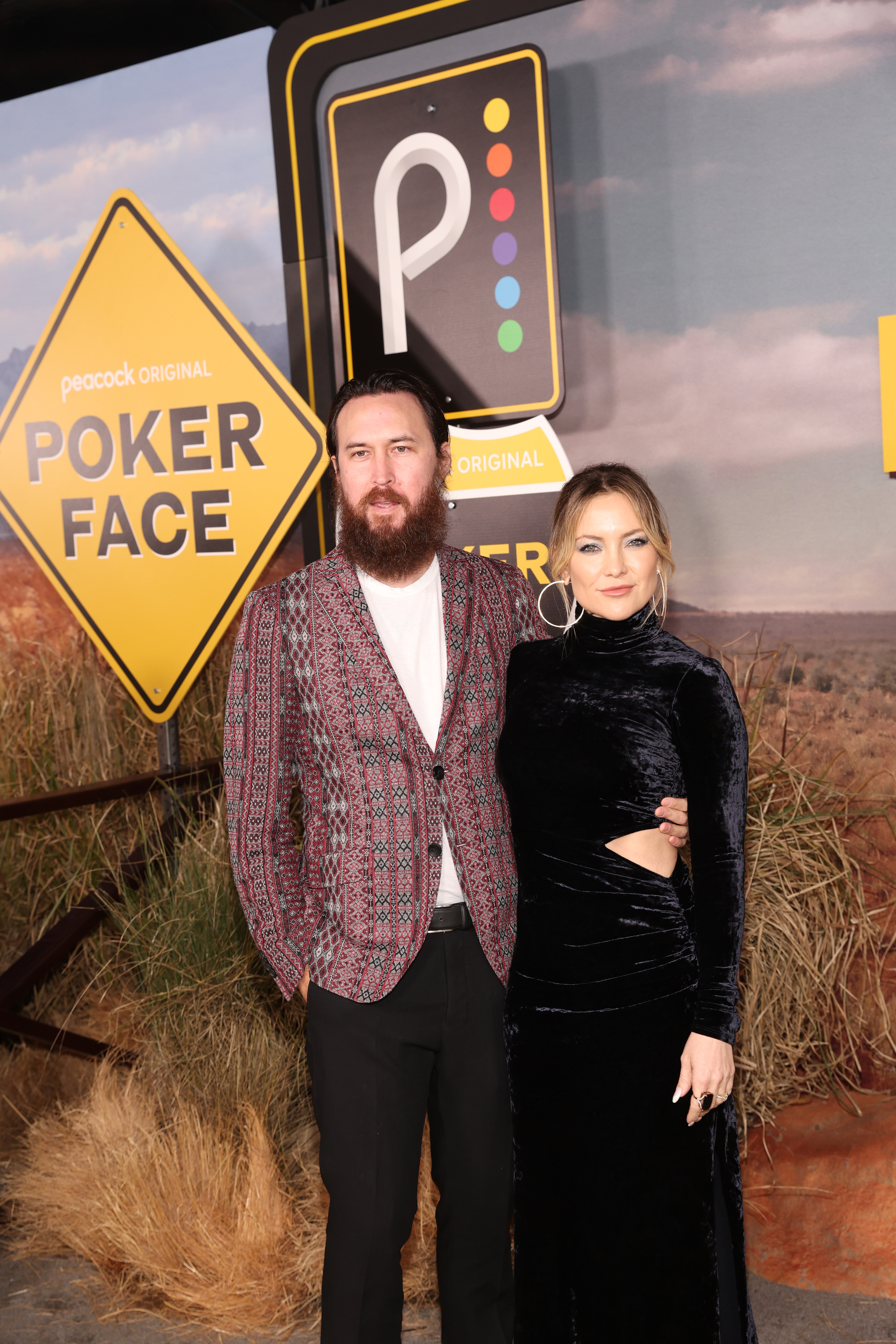 Ben Sinclair and Kate Hudson at the &quot;Poker Face&quot; premiere. Ben wears a patterned jacket with black pants, and Kate is in a sleek black velvet dress