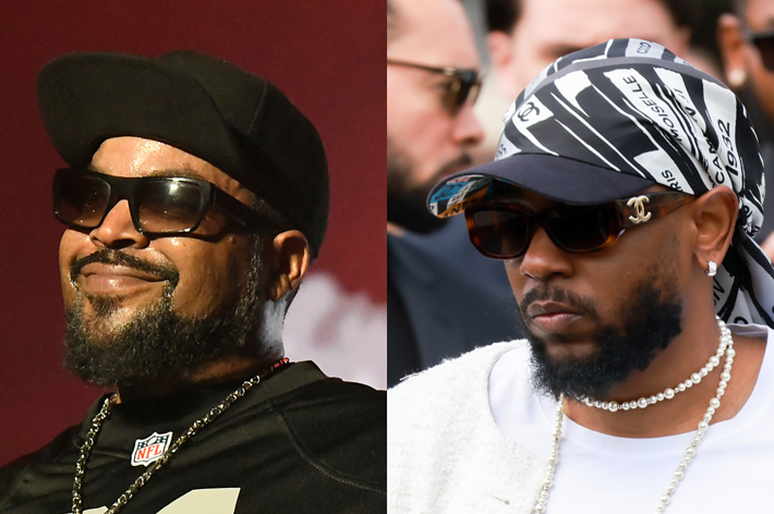 Ice Cube and Kendrick Lamar, both wearing sunglasses and hats, stand side by side. Ice Cube is smiling and wearing a shirt with a number, while Kendrick wears a headscarf and necklace