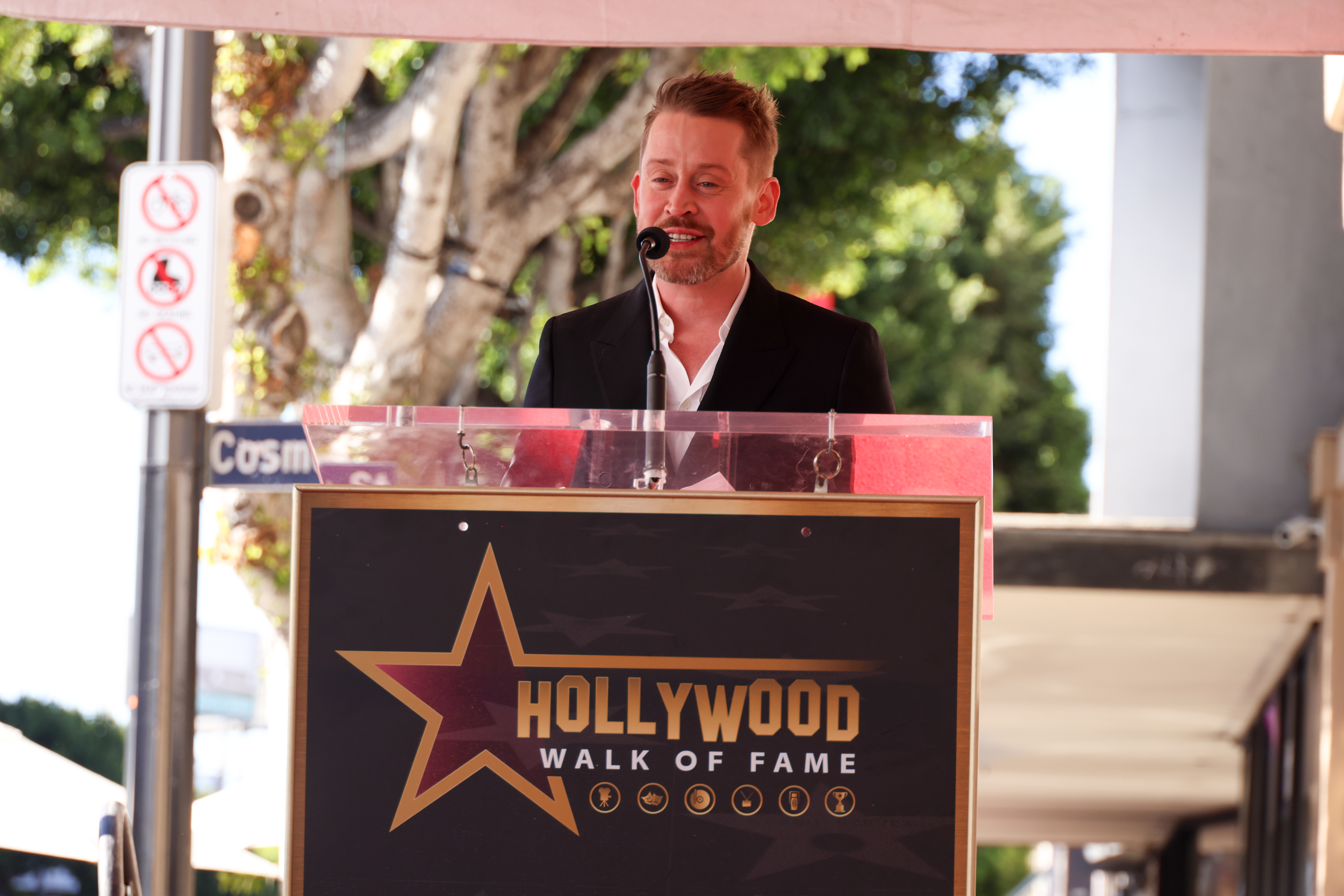 Man giving a speech at the Hollywood Walk of Fame podium