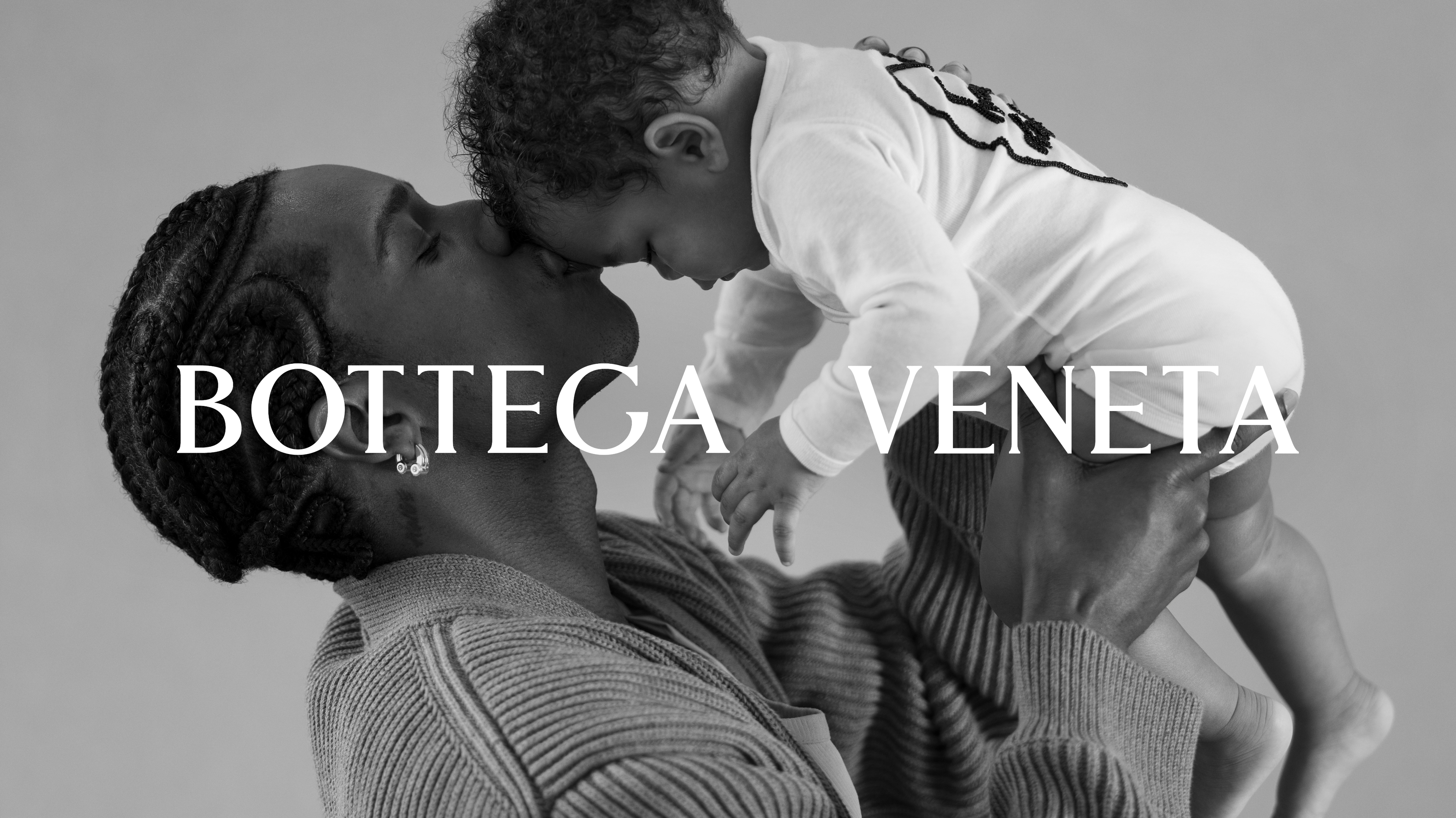 Pusha T embraces his son, who is wearing a white onesie, in a tender moment for a Bottega Veneta campaign