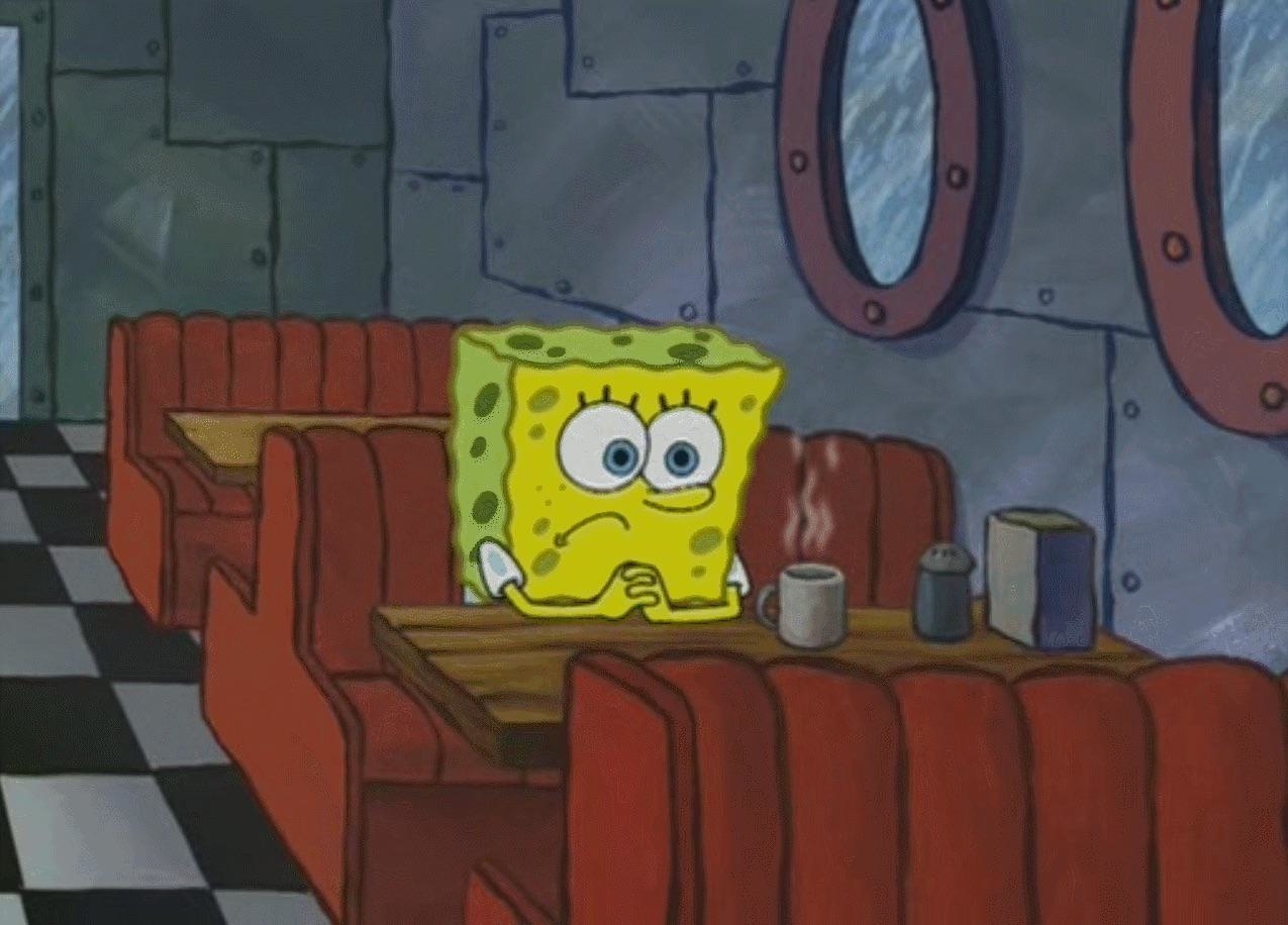 SpongeBob SquarePants sits alone at a diner booth, staring at a coffee cup with a pensive expression