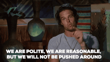 A man is speaking emphatically in a room with tribal decor. The text overlay reads, &quot;We are polite, we are reasonable, but we will not be pushed around.&quot;