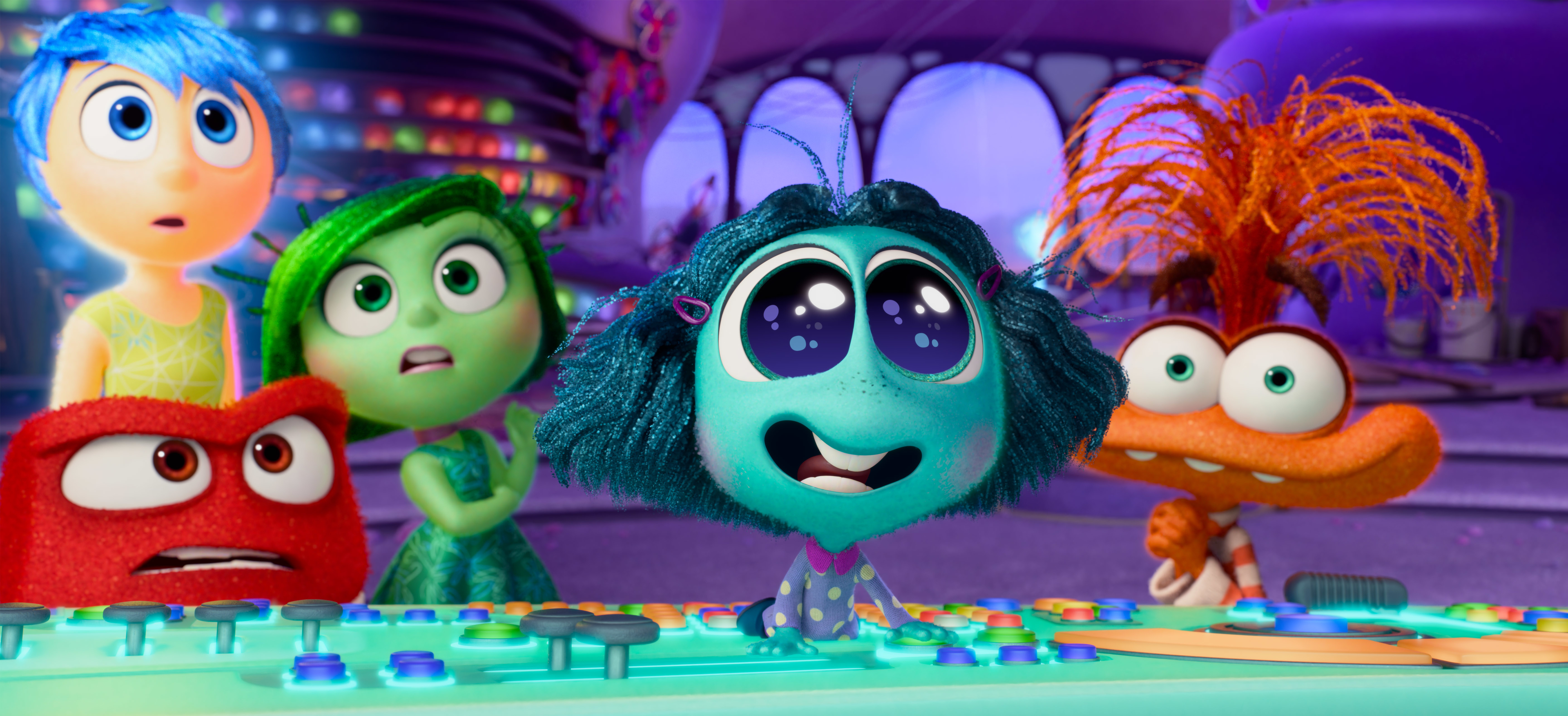 Joy, Disgust, Anger, Sadness, and Fear from "Inside Out" standing in front of a control panel, displaying various emotions
