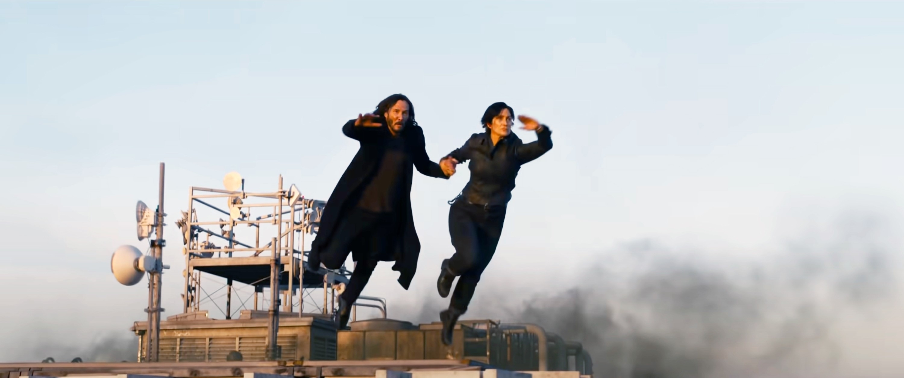 Keanu Reeves and Carrie-Ann Moss pulling off impressive stunts in the Matrix.