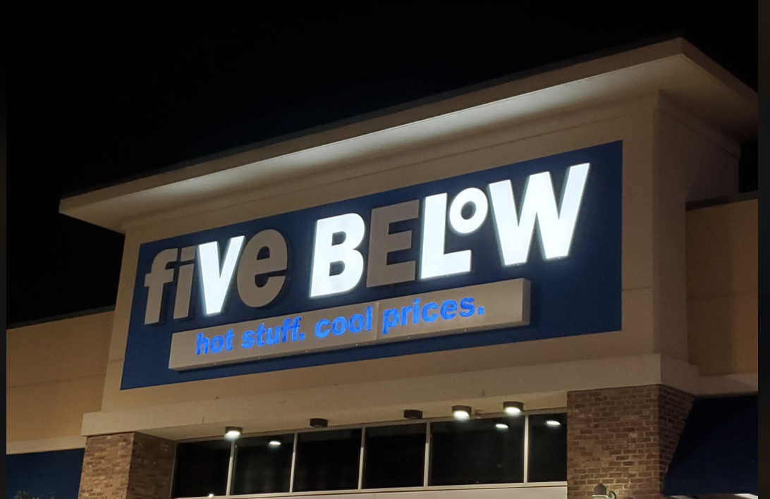 Storefront of Five Below with the slogan "hot stuff. cool prices." displayed prominently above the entrance