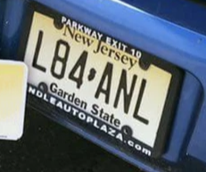 New Jersey license plate with the text "L84ANL" on a blue car