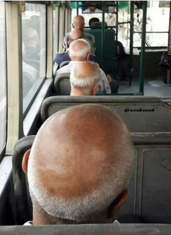 Bus passengers with bald heads and white hair are seated in line, making an unintentionally humorous pattern