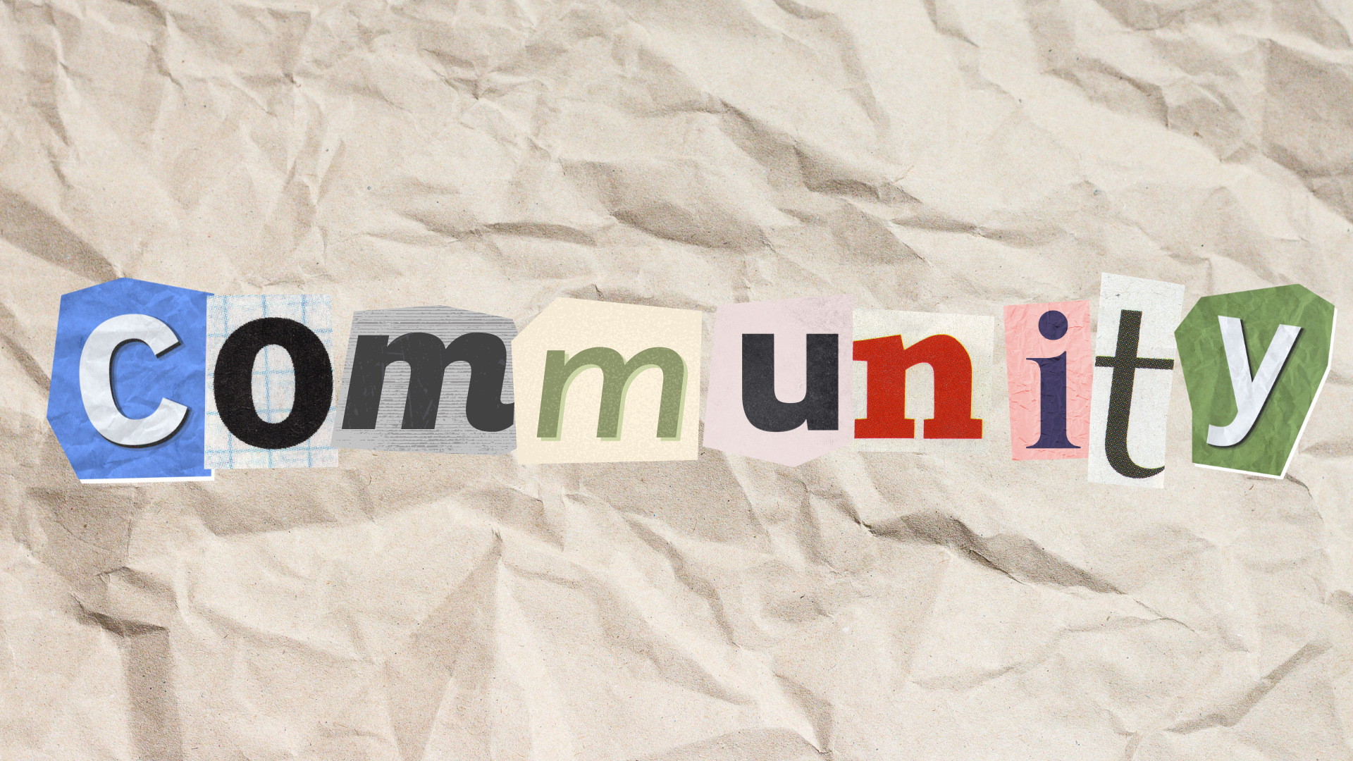 Cut-out letters spell &quot;Community&quot; on a crumpled paper background
