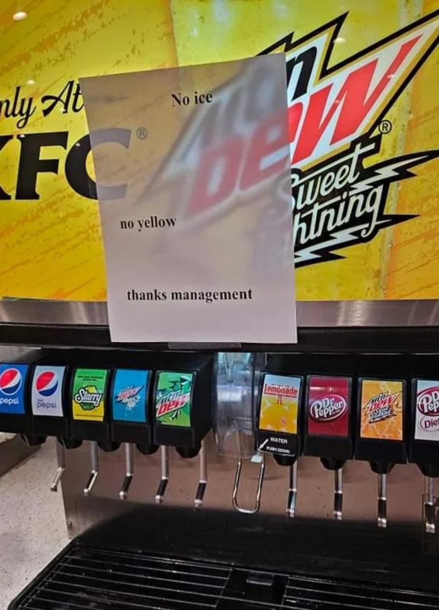 Sign on soda machine reading "No ice, no yellow, thanks management" above assorted drink dispensers including Pepsi, Sierra Mist, and Dr Pepper at a KFC