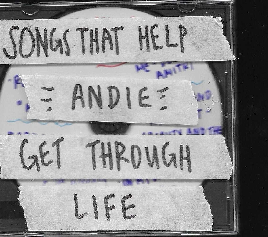 CD case labeled &quot;Songs That Help Andie Get Through Life&quot; using pieces of tape with handwritten text