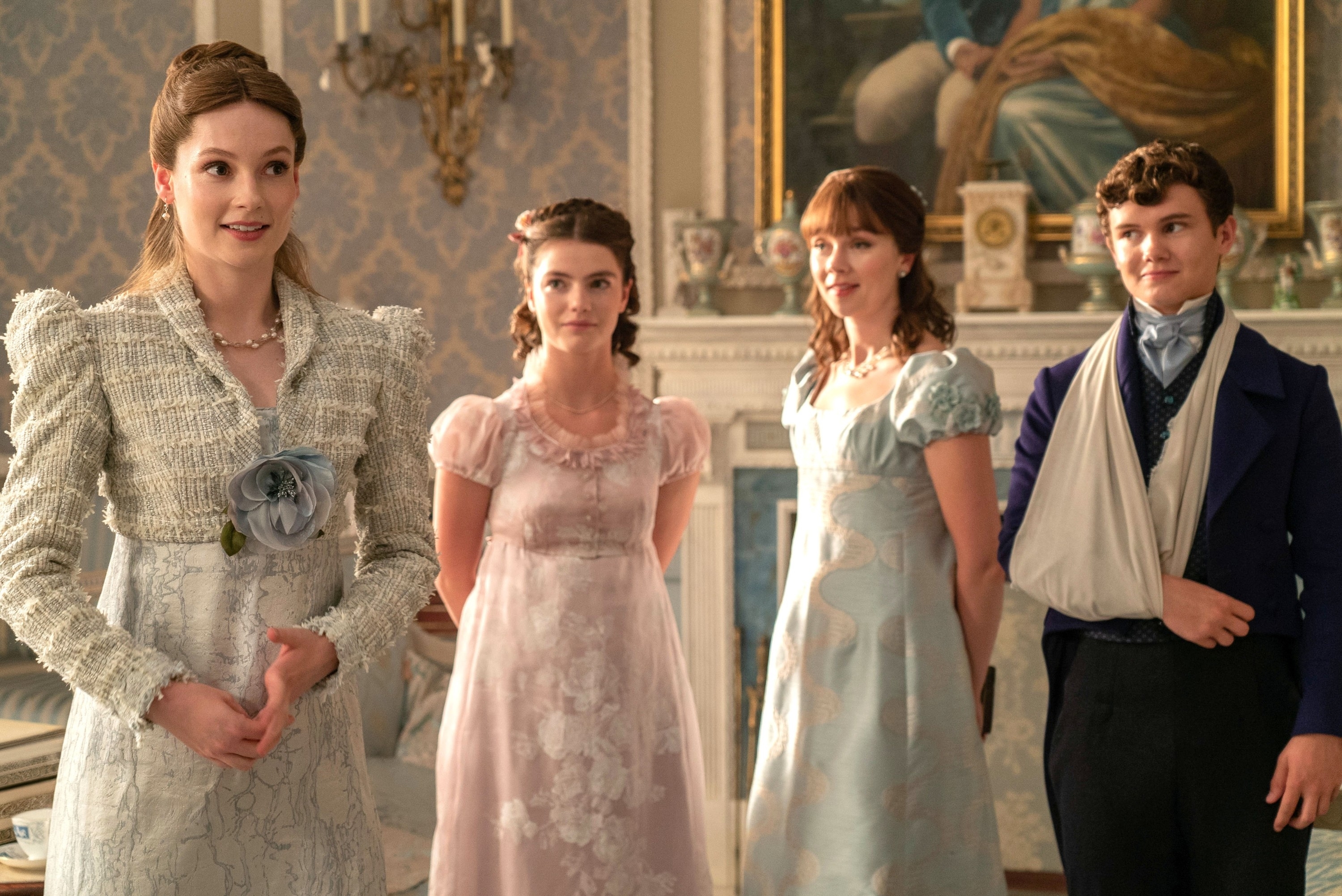 Four of the "Bridgerton" children standing in their home