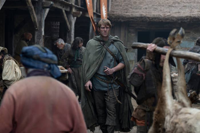A man is seen walking through a village in a scene from "A Knight of the Seven Kingdoms"