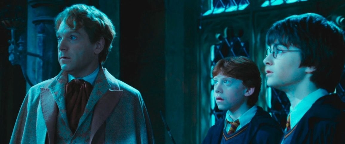 Kenneth Branagh as Gilderoy Lockhart, Rupert Grint as Ron Weasley, and Daniel Radcliffe as Harry Potter in a scene from a Harry Potter movie