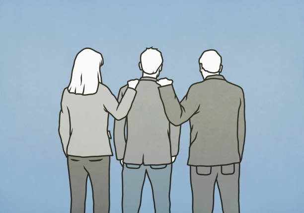 3人のビジネススーツを着た人が並んで立っており、中央の人物に左右両側の人物が手を置いています。