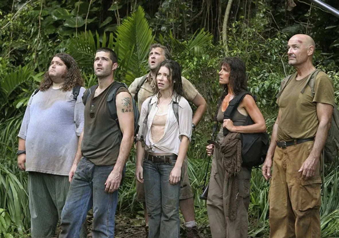 Jorge Garcia, Matthew Fox, Josh Holloway, Evangeline Lilly, Danielle Rousseau, and Terry O'Quinn standing in a jungle, looking up with concerned expressions