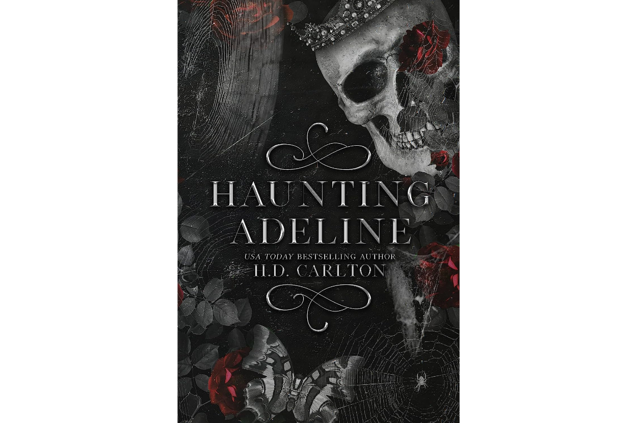 Book cover of "Haunting Adeline" by H.D. Carlton. The cover features a skull adorned with a jeweled crown and dark, gothic elements like flowers and butterflies