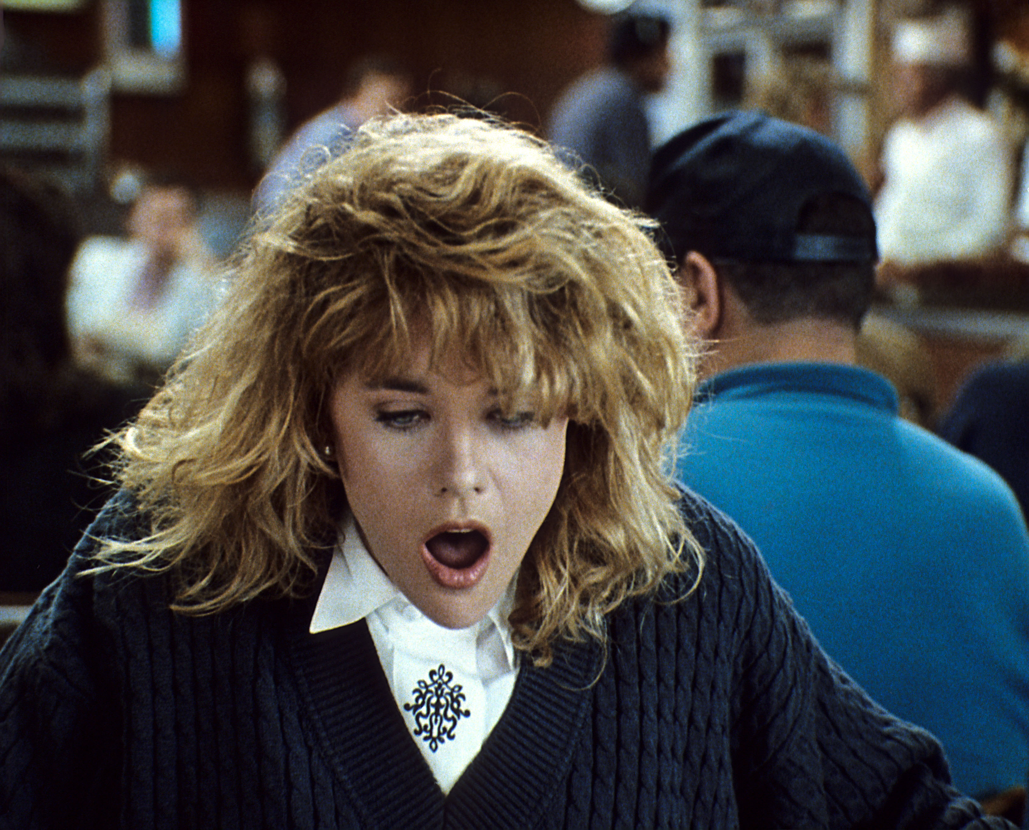 Meg Ryan with her jaw dropped in a scene from "When Harry Met Sally"