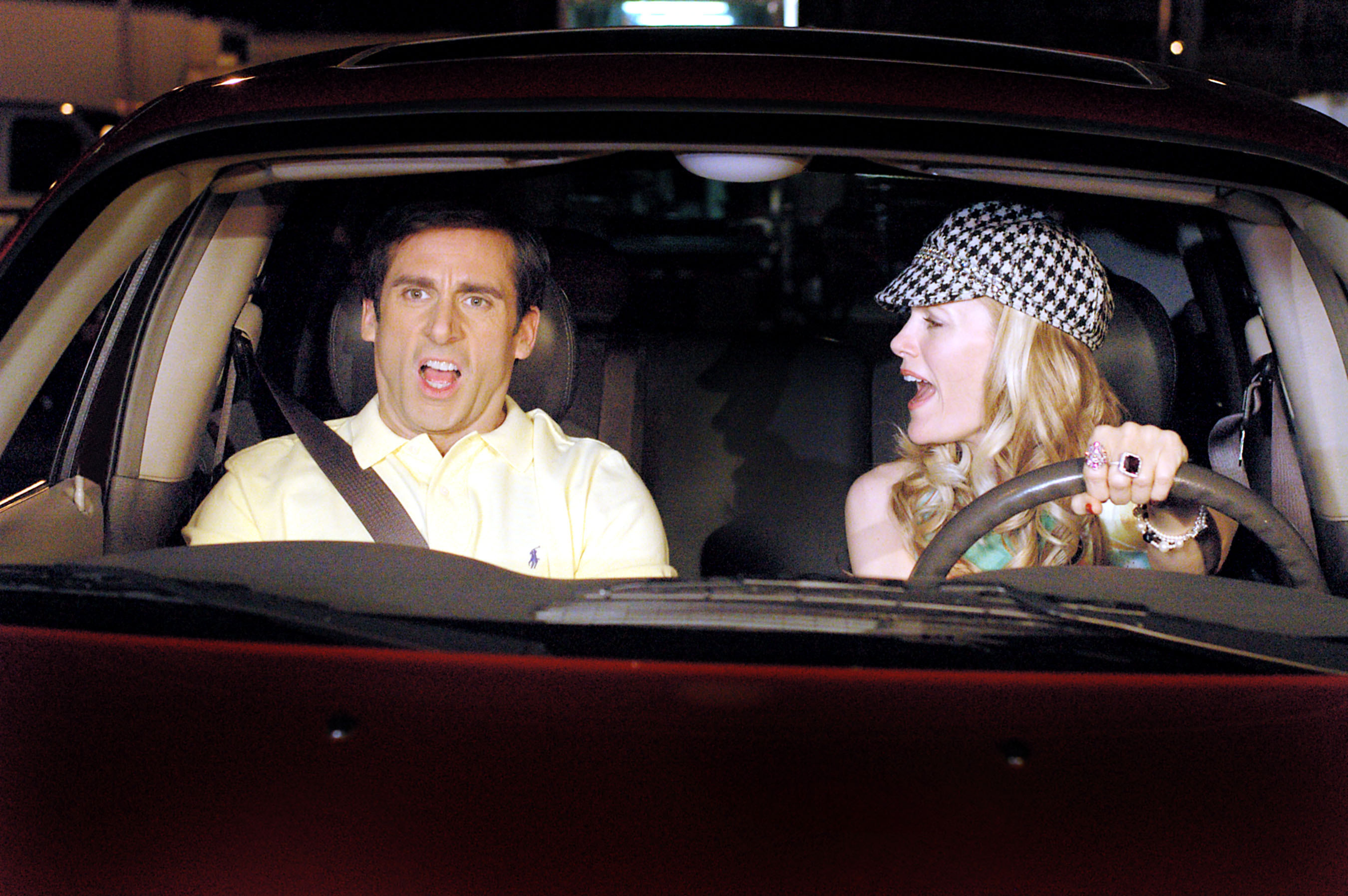 Steve Carell, Leslie Mann sitting in a car together with this mouths open in a scene from &quot;The 40-Year-Old Virgin&quot;