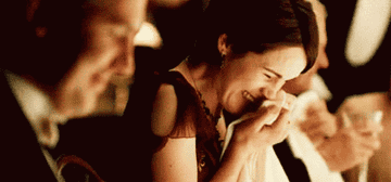 Matthew and Mary in "Downton Abbey" laughing