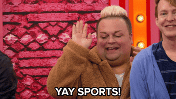 Two people are cheering. The person on the left high-fives and mouths "YAY SPORTS!" The person on the right smiles and claps