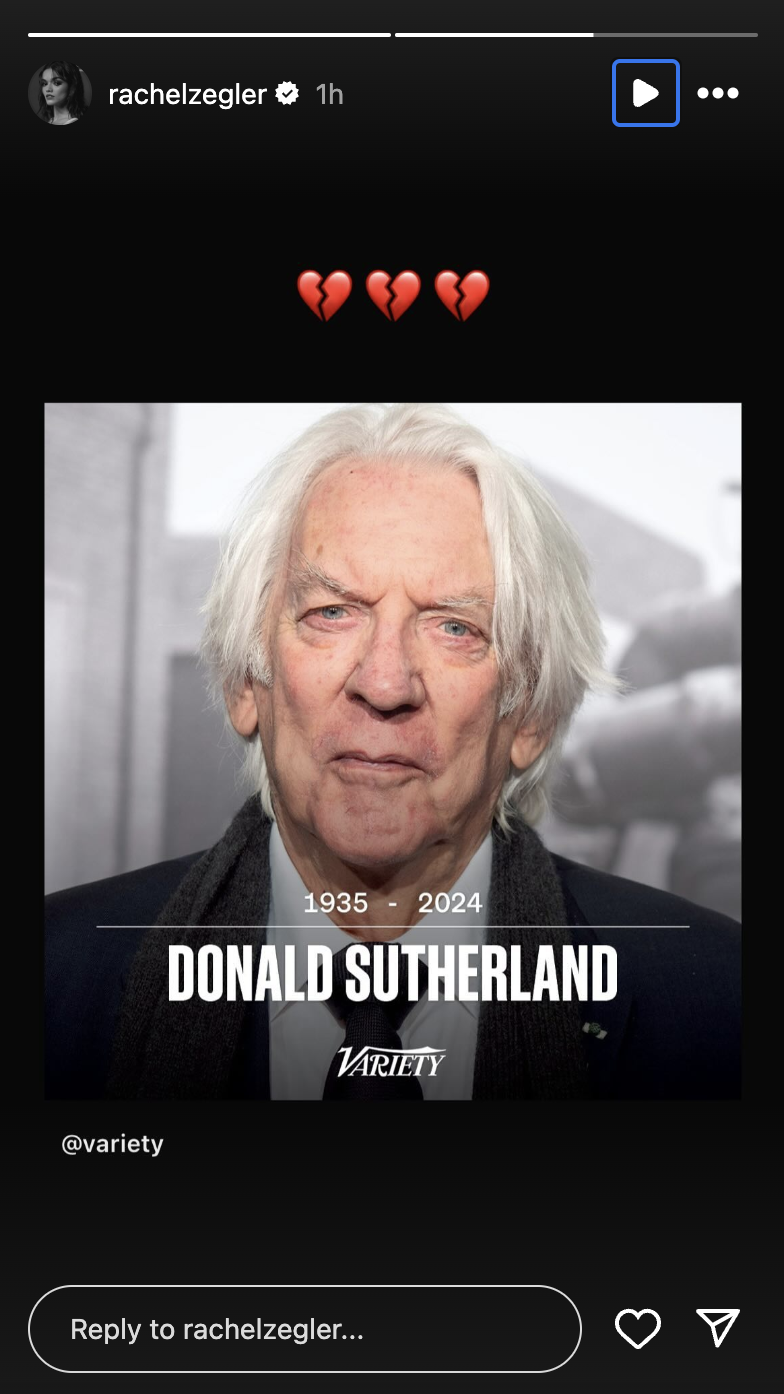 Image of an Instagram story by @rachelzegler featuring a photo of Donald Sutherland with text below reading "1935 - 2024." Heartbroken emojis are shown above the image