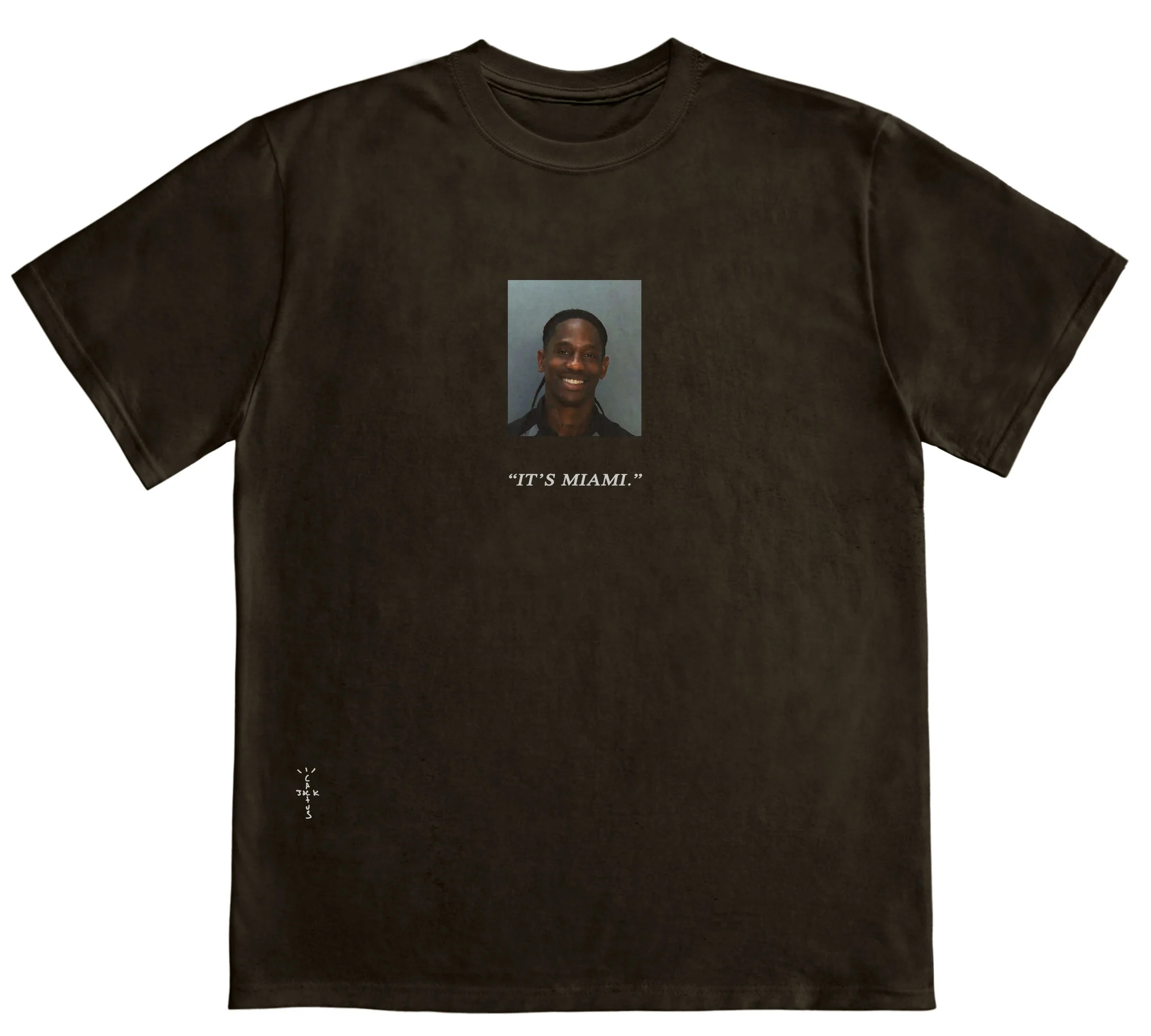 Black t-shirt with a small photo of a smiling man centered on the chest, captioned &quot;IT&#x27;S MIAMI.&quot;