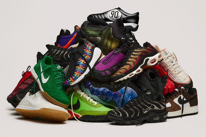 A pile of various fashionable sneakers, showcasing many different styles and designs