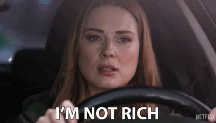 A woman driving a car with serious expression, text overlay reads, "I'M NOT RICH"