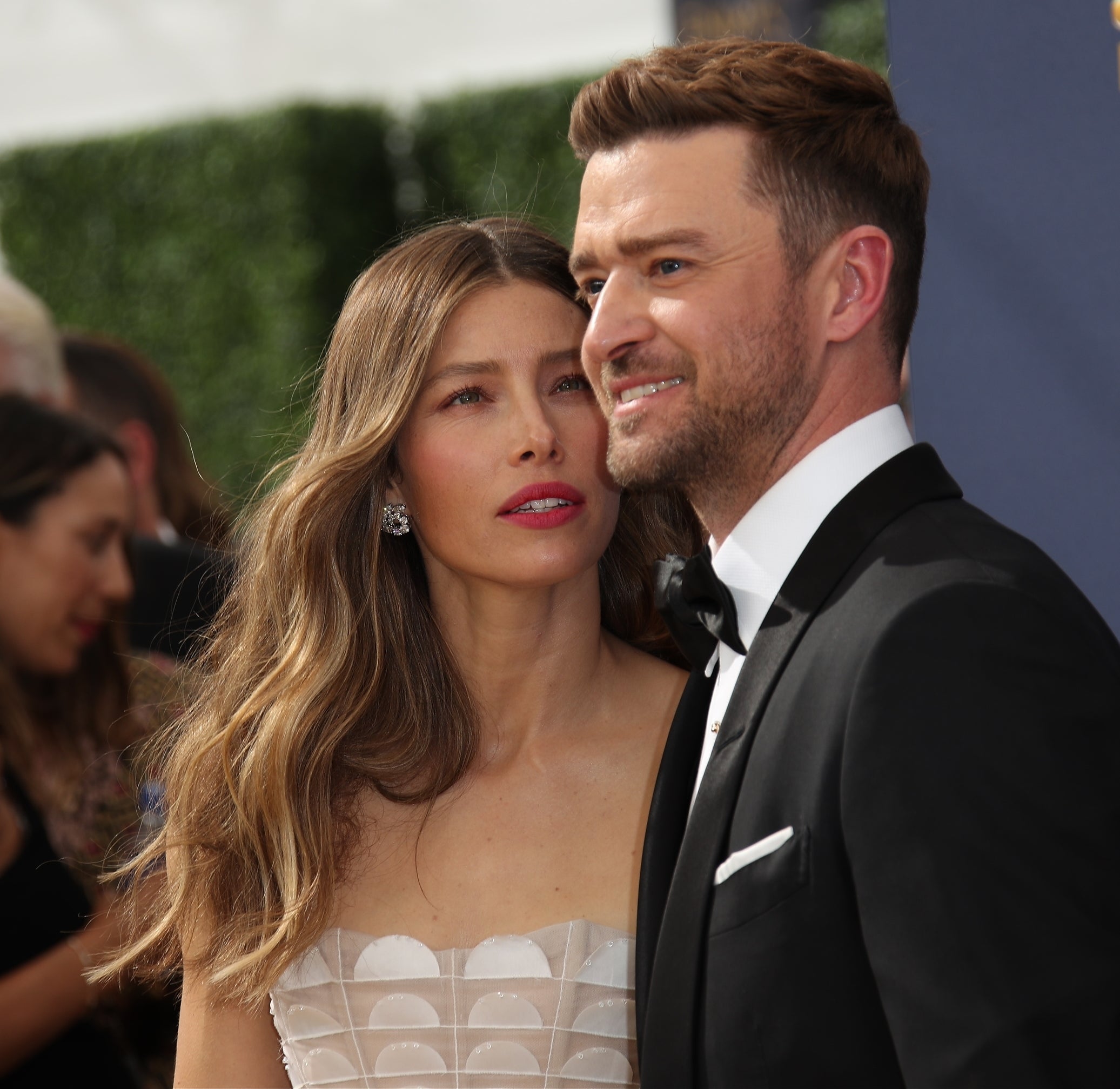 Jessica Biel and Justin Timberlake on the red carpet at the 70th Emmy Awards. Jessica is wearing a strapless dress, and Justin is in a suit with a bow tie