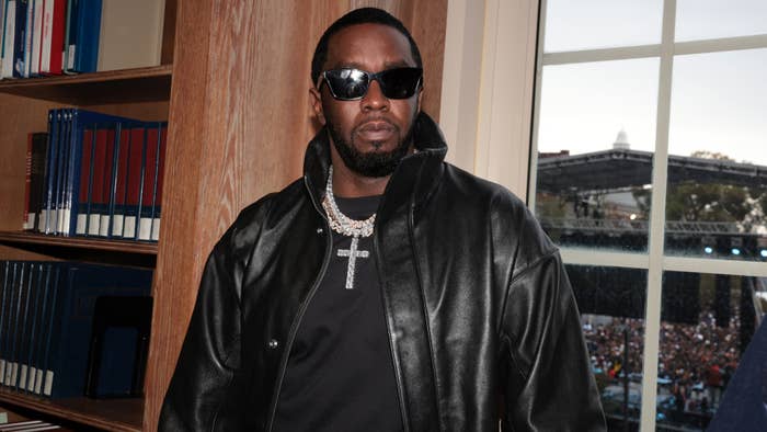 Sean &quot;Diddy&quot; Combs, wearing a black leather jacket and sunglasses, attends a music event