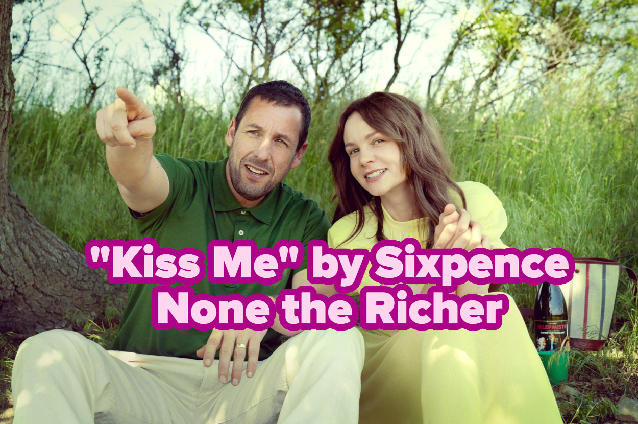 Adam Sandler and Carey Mulligan sit on grass, pointing and smiling with text overlay: "Kiss Me" by Sixpence None the Richer