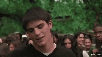Josh Hartnett smiles and gestures with his hands.