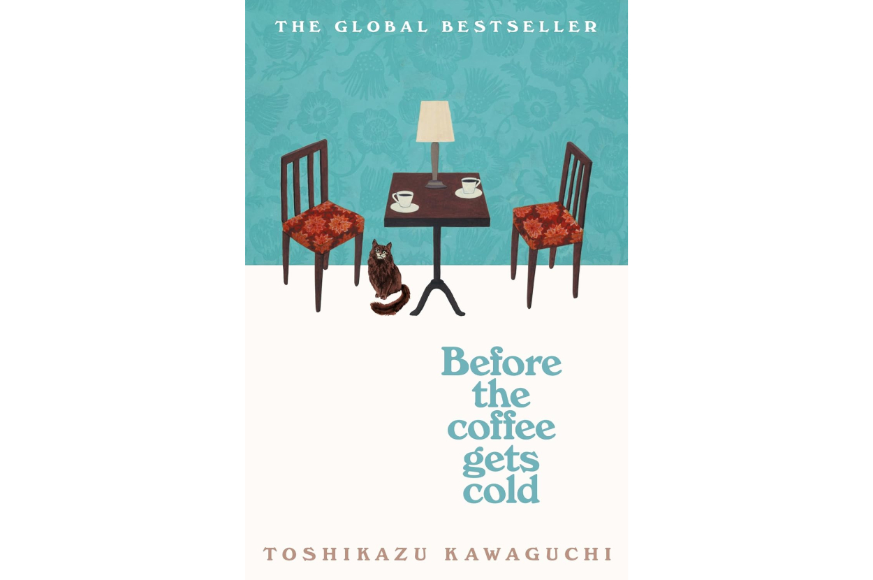 Book cover of "Before the Coffee Gets Cold" by Toshikazu Kawaguchi, showing two chairs and a table with a lamp and coffee cups, plus a cat between the chairs