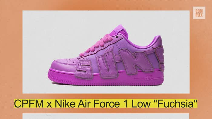 CPFM x Nike Air Force 1 Low &quot;Fuchsia&quot; sneaker with bold &quot;SUN!&quot; lettering on the side, displayed against an orange backdrop