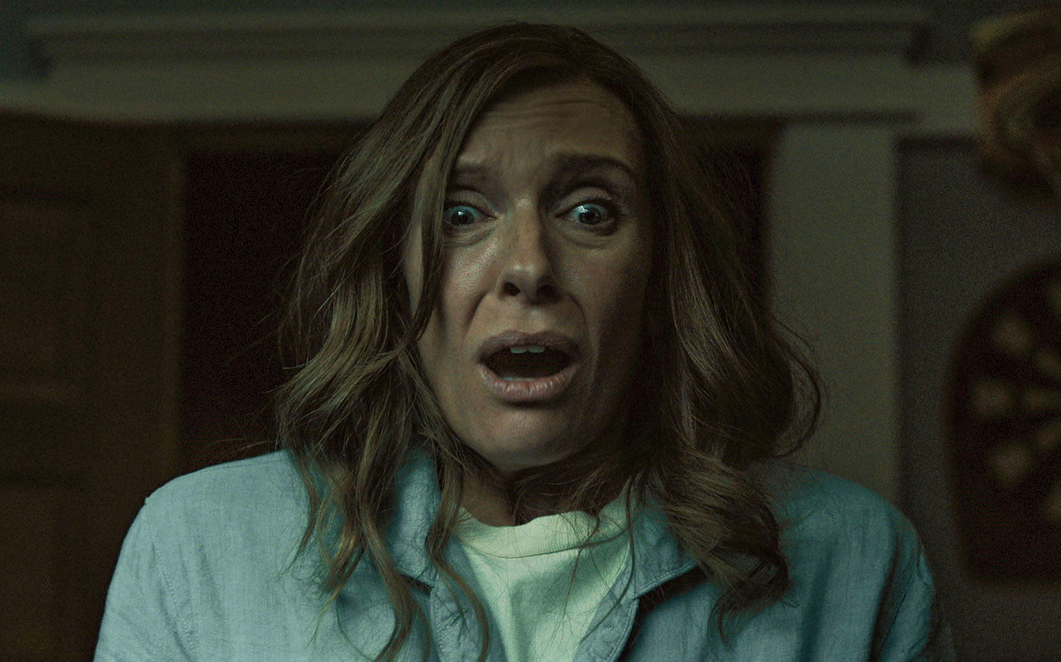 Toni Collette looks shocked and terrified in a scene from the movie "Hereditary"