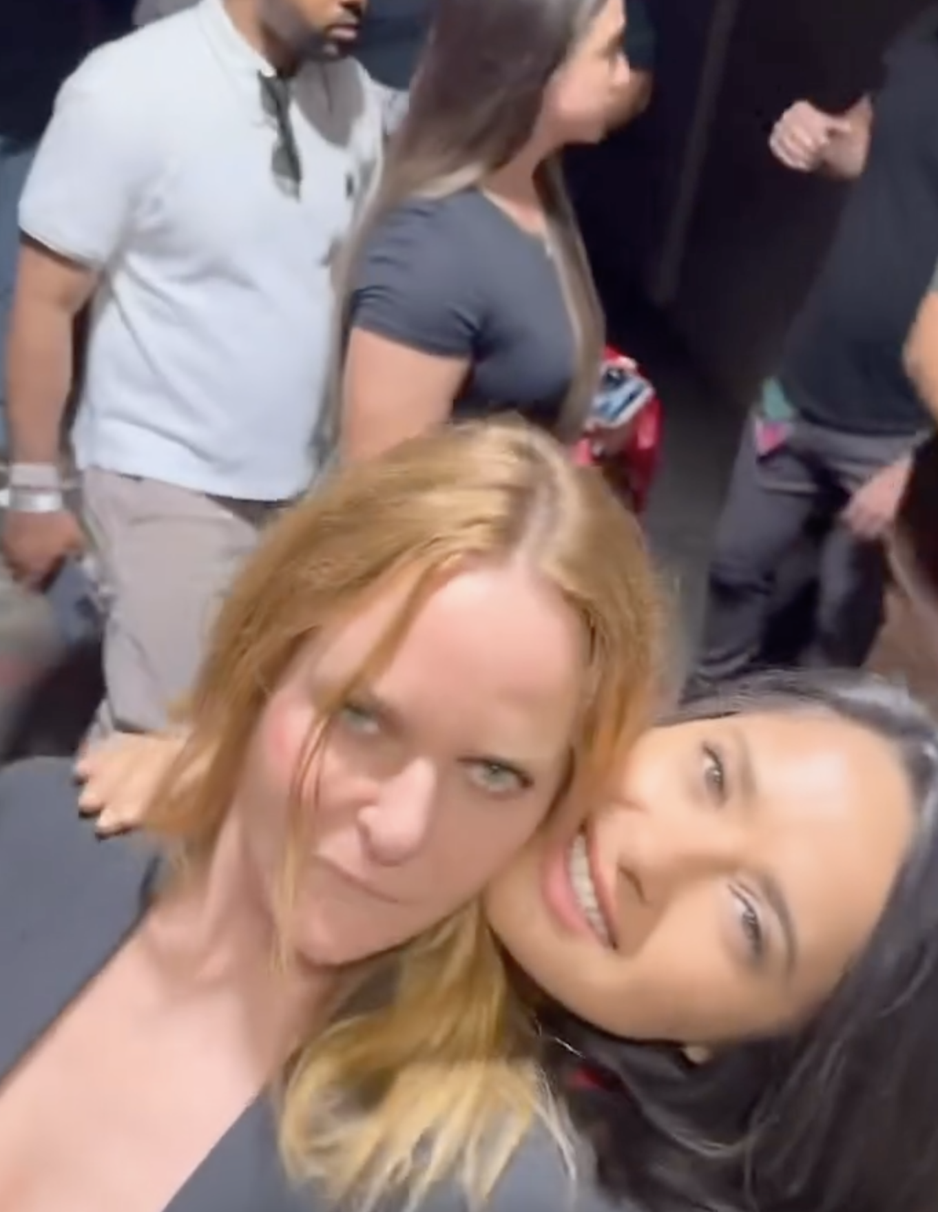 Stella McCartney and Salma Hayek take a selfie at an event