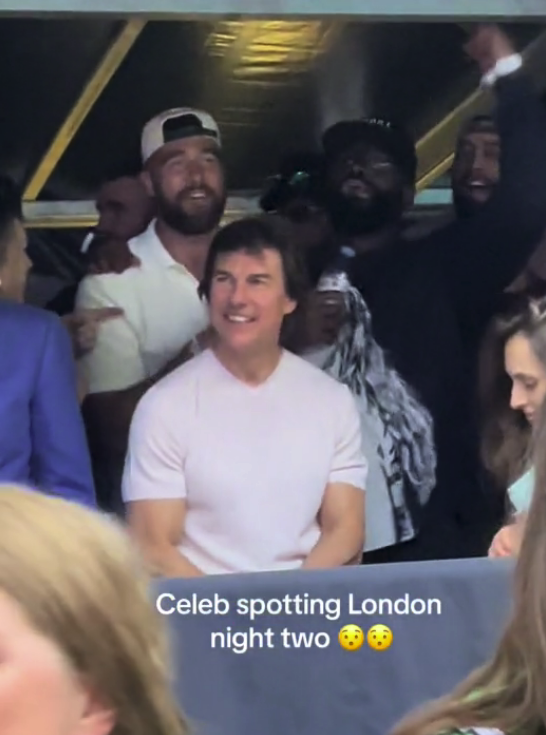 Tom Cruise smiling and seated at an event surrounded by people with a caption reading &quot;Celeb spotting London night two.&quot;
