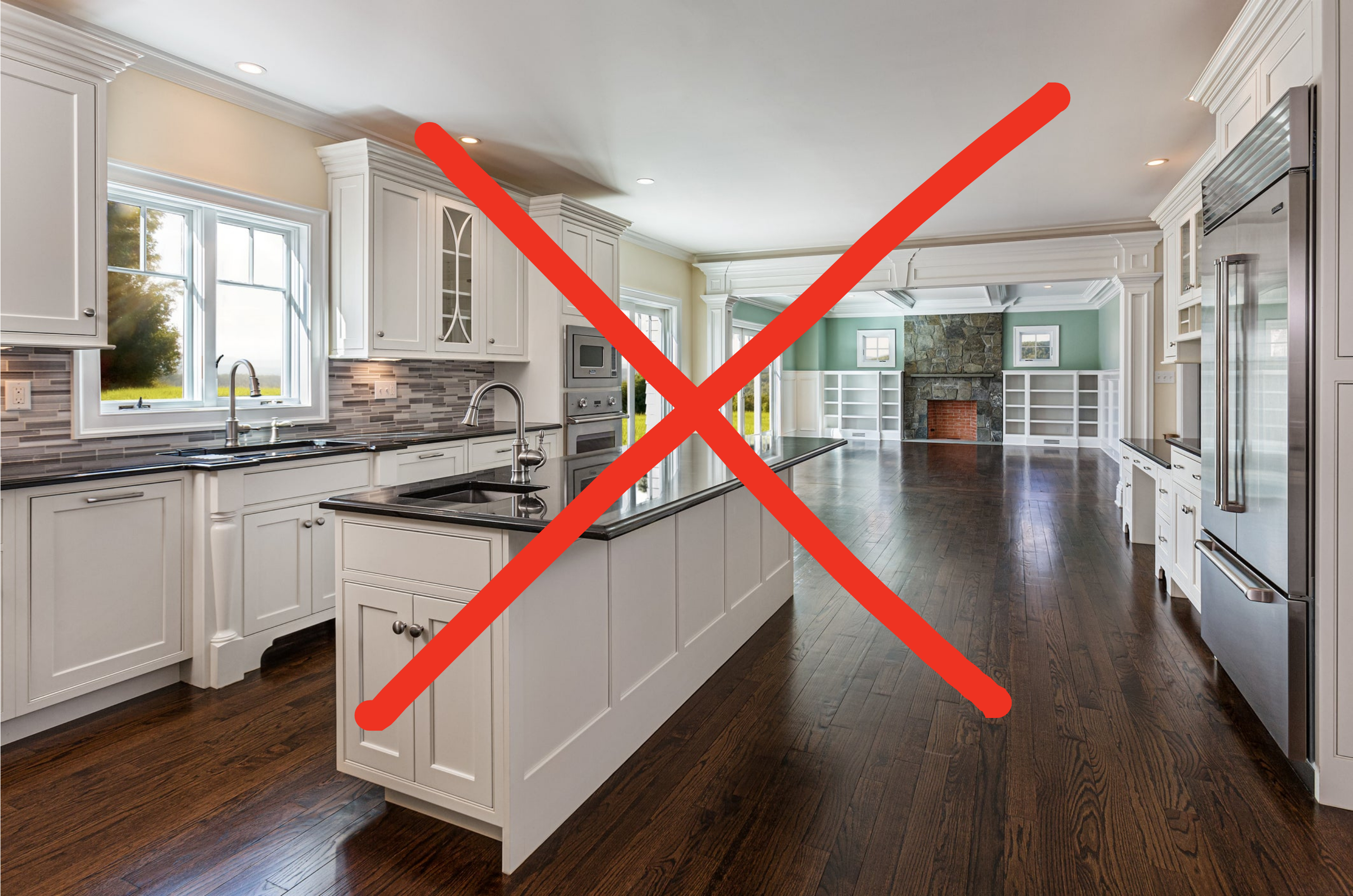 Spacious modern kitchen with white cabinetry, stainless steel appliances, dark hardwood floors, an island, and a view of a living area with a fireplace