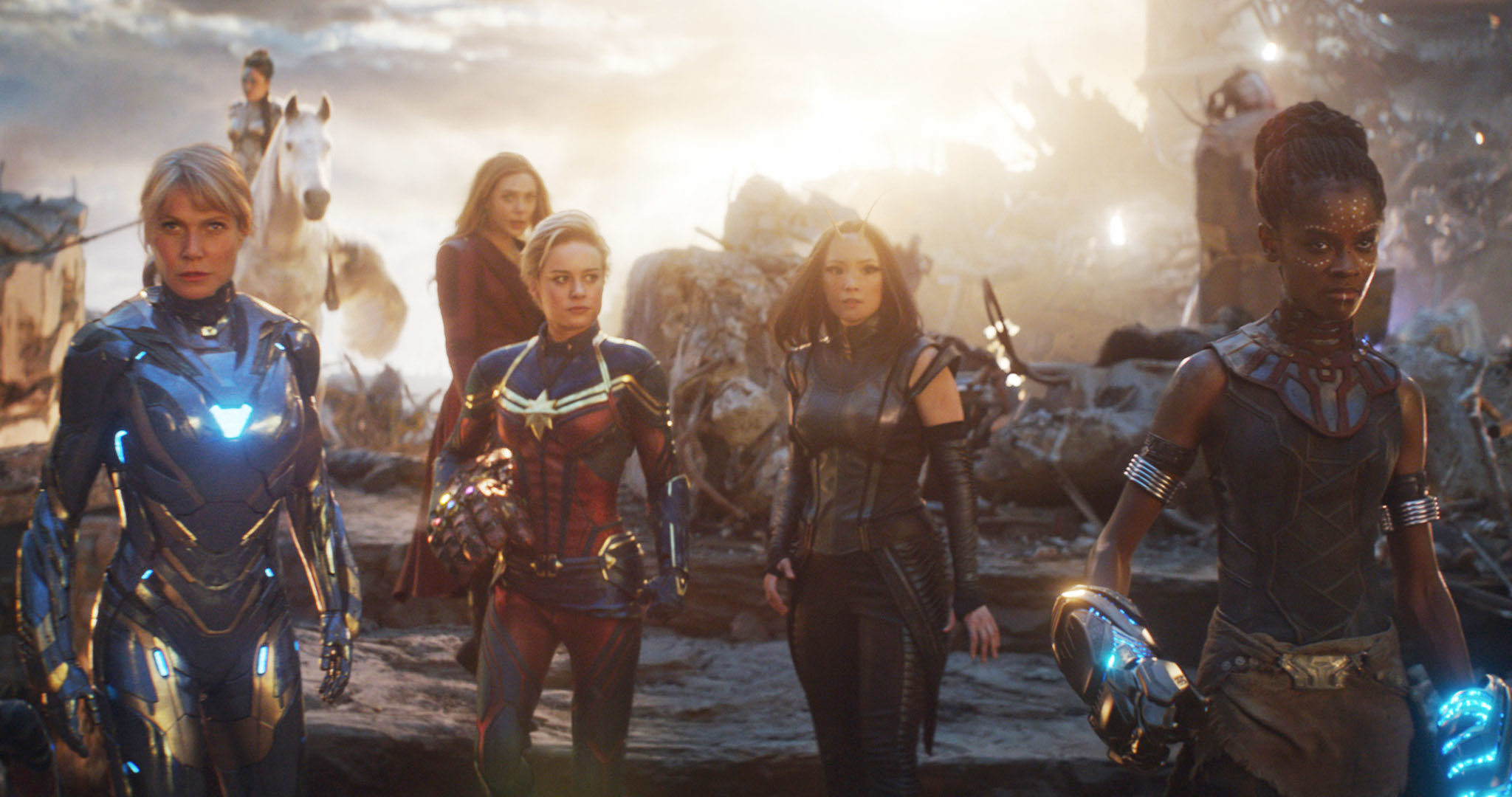 Gwyneth Paltrow, Elizabeth Olsen, Brie Larson, Evangeline Lilly, and Letitia Wright in superhero costumes in a scene from a movie