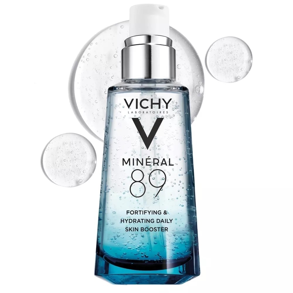 Vichy Mineral 89 Fortifying &amp; Hydrating Daily Skin Booster bottle with bubbles in the background