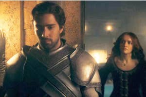 A scene from TV show "House of the Dragon" featuring Ser Criston Cole in armor walking ahead of Alicent, who is in a long dress