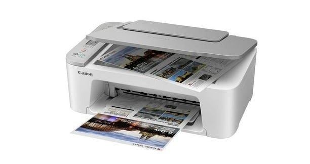 Canon printer printing out colorful photos, showcasing its photo printing capabilities