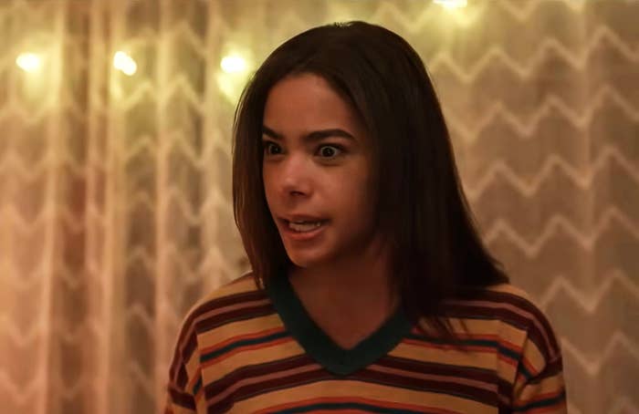 Antonia Gentry wearing a striped shirt with a concerned expression in a scene from "Prom Dates"