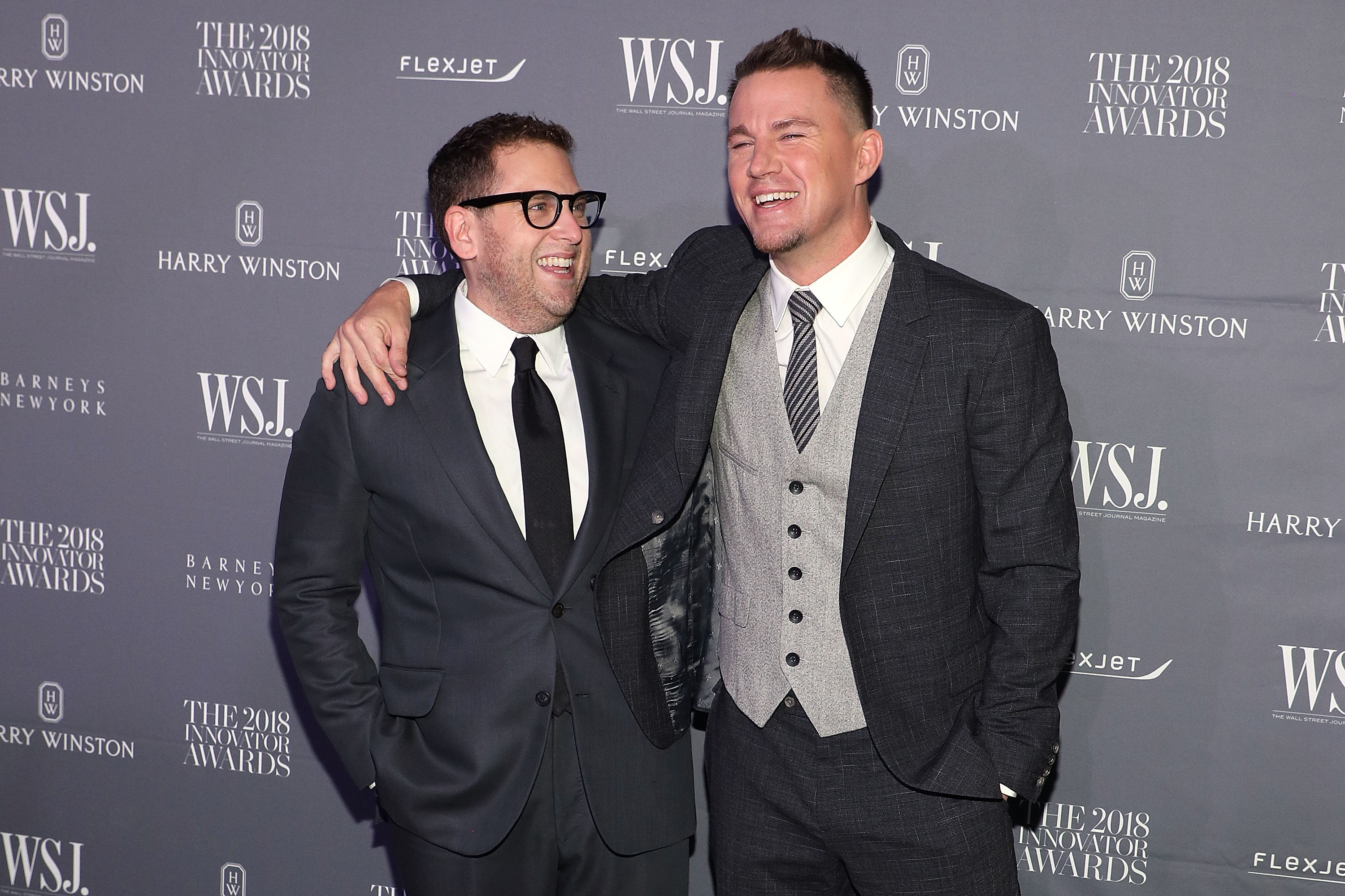 Closeup of Jonah Hill and Channing Tatum on the red carpet with their arms around each other