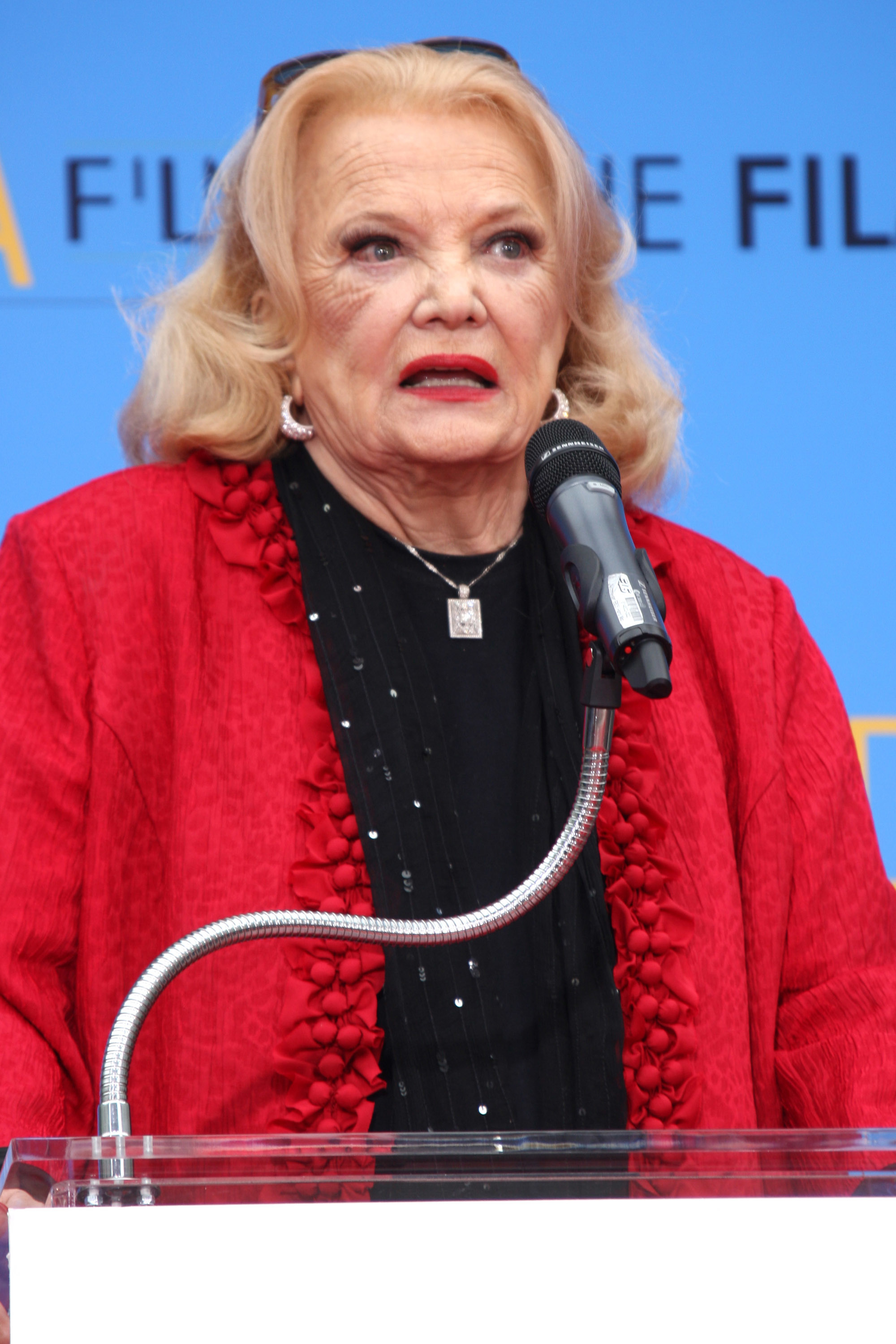Closeup of Gena Rowlands speaking at a podium
