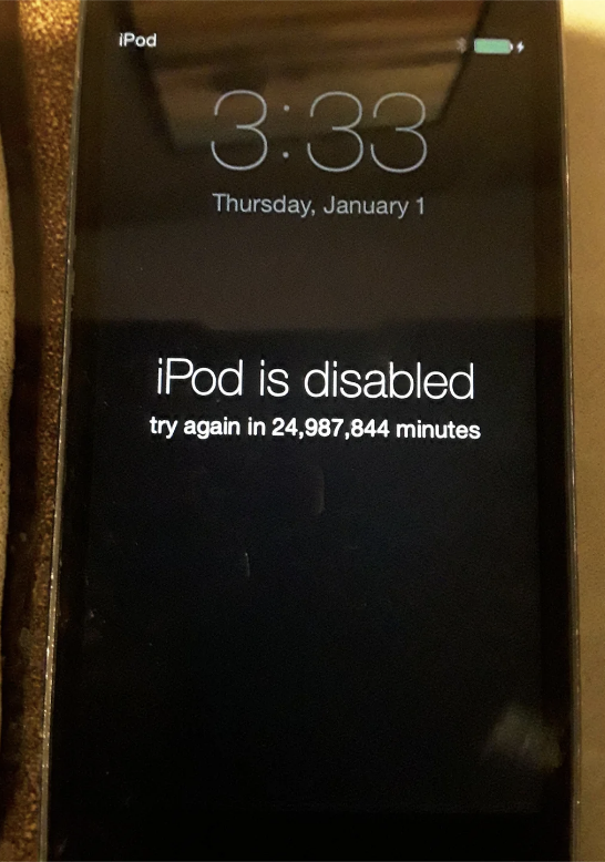 iPod screen showing "iPod is disabled, try again in 24,987,844 minutes" message on a Thursday, January 1, at 3:33 AM