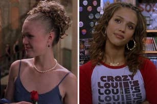 Julia Stiles in a dress with a pearl necklace holding a rose next to Jessica Alba in a t-shirt with large hoop earrings and a "Baby" necklace
