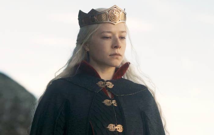Emma D&#x27;Arcy as Princess Rhaenyra Targaryen wearing a dark medieval gown and golden crown from the TV series House of the Dragon
