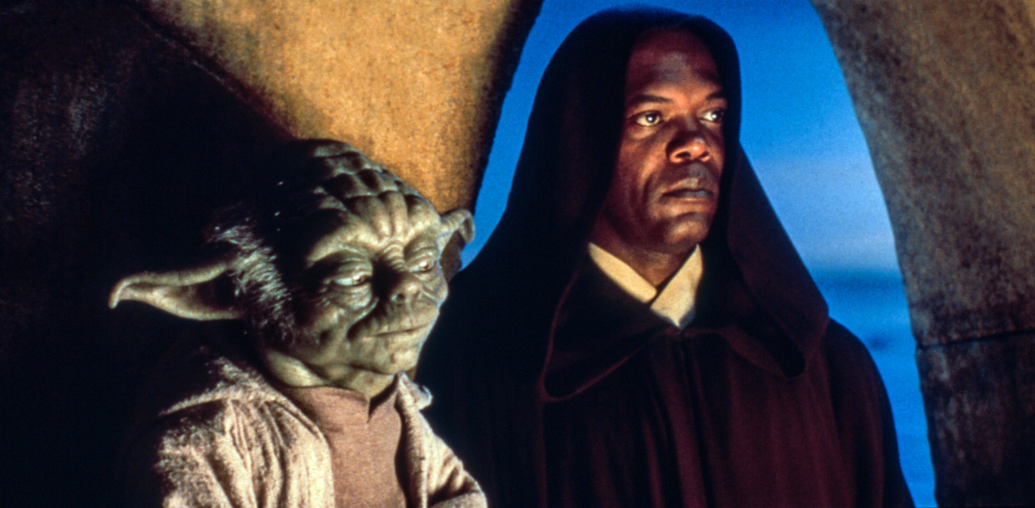 Yoda and Mace Windu, characters from Star Wars, stand side by side, both wearing Jedi robes