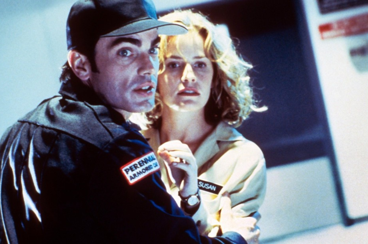 Man in a uniform labeled "Pernell" and woman in a shirt labeled "Susan" look alarmed in a dramatic scene